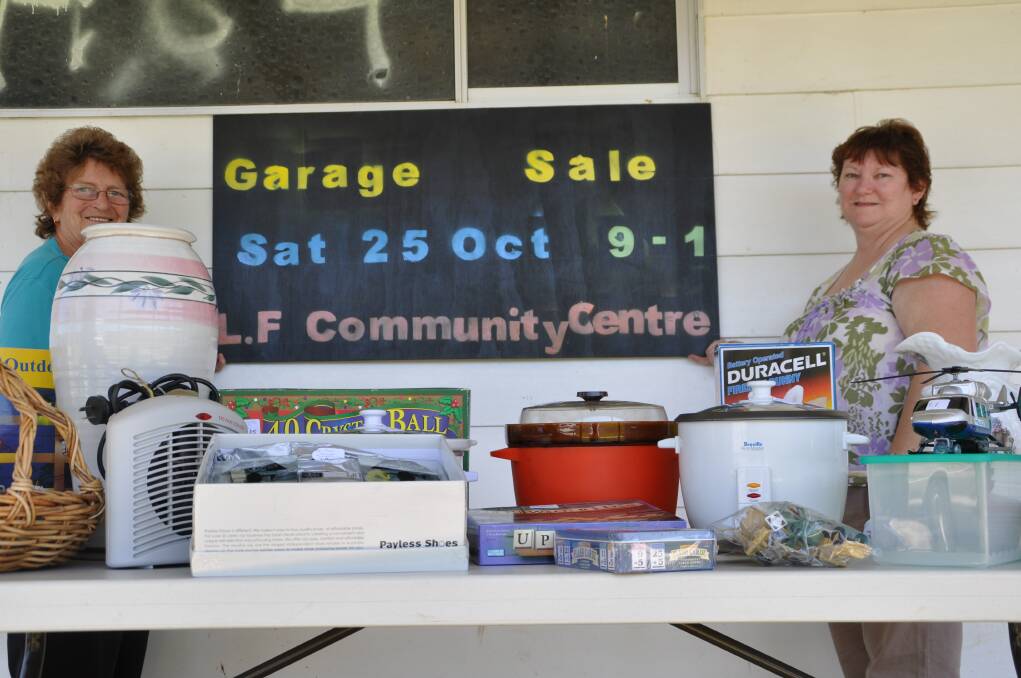 Community effort: The Long Flat football ground will be stacked high with things to buy at the Garage Sale Trail event on Saturday. June Rollan and Rhonda O'Brien are pictured getting ready for the sale earlier this week