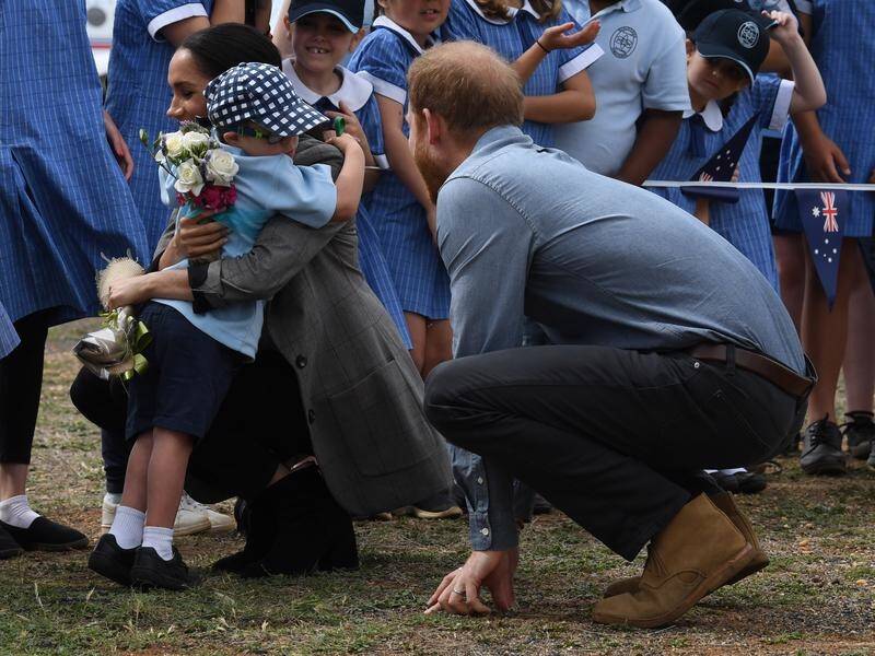 Five-year-old Luke Vincent got hugs from both Prince Harry and Meghan when they arrived in Dubbo.