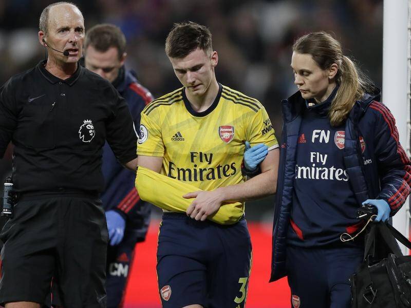 Arsenal defender Kieran Tierney (C) could be out for three months after dislocating his shoulder.
