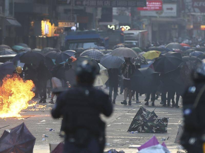 A stand-off between anti-government protesters and riot police continues at a Hong Kong university.