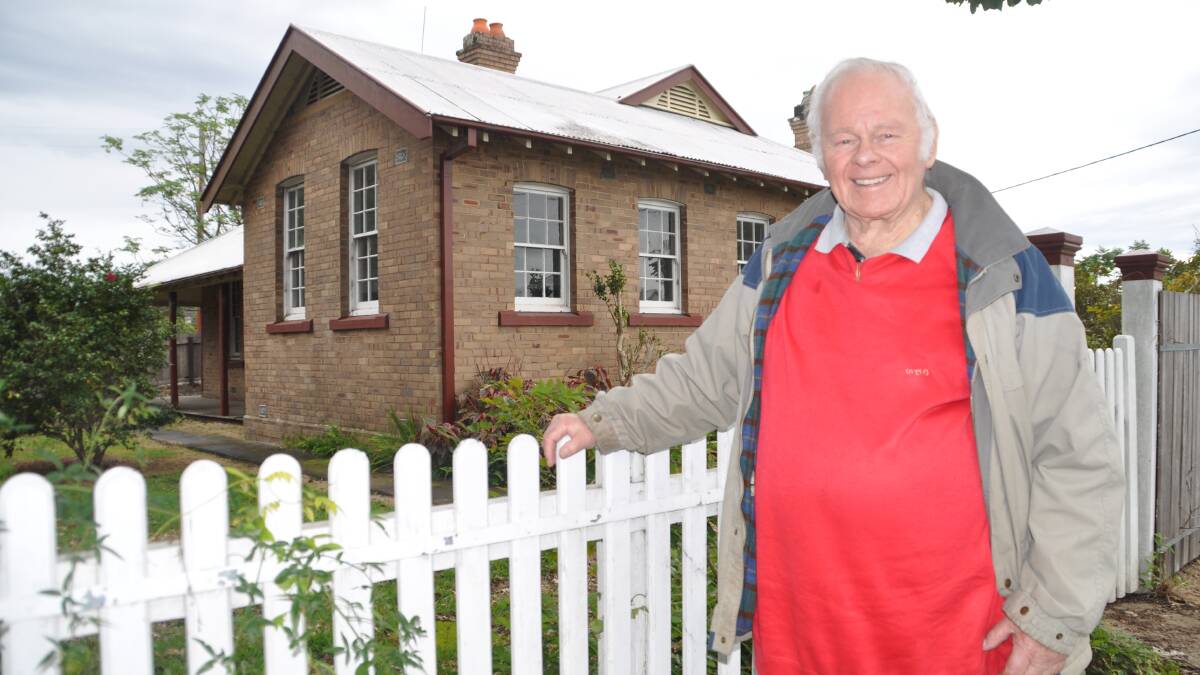Big plans: A delighted Ray Cooper in front of the station master's cottage, which will be turned into a tourist information centre and the Wauchope Historical
Society's new home.