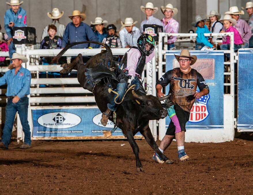 Levi Ward holds on to the bucking bull at the Youth Bull Riding World Finals in America. Photo: Supplied