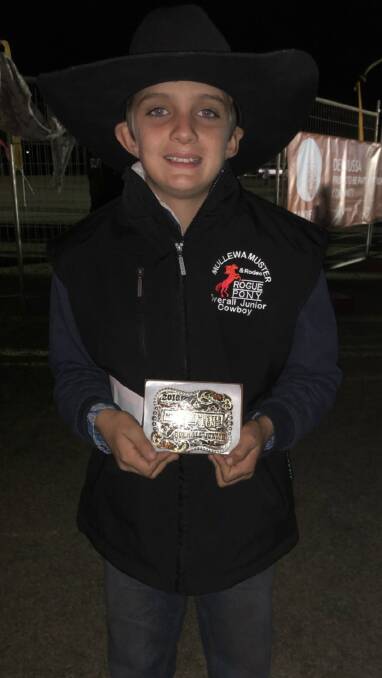 Levi Ward proudly holds up the Under-18s All-Round Junior Cowboy buckle.