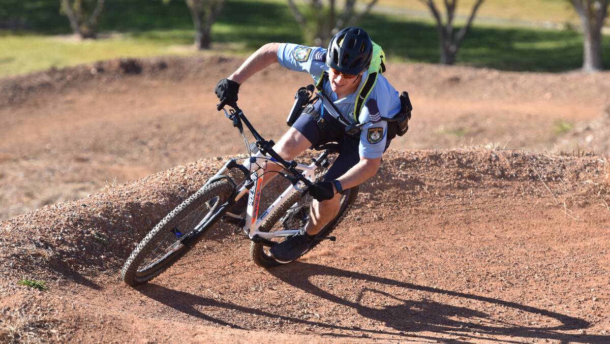 Tight turn: Sergeant Brett Barnes from Sydney demonstrates some of the tough training he put fellow officers through. 